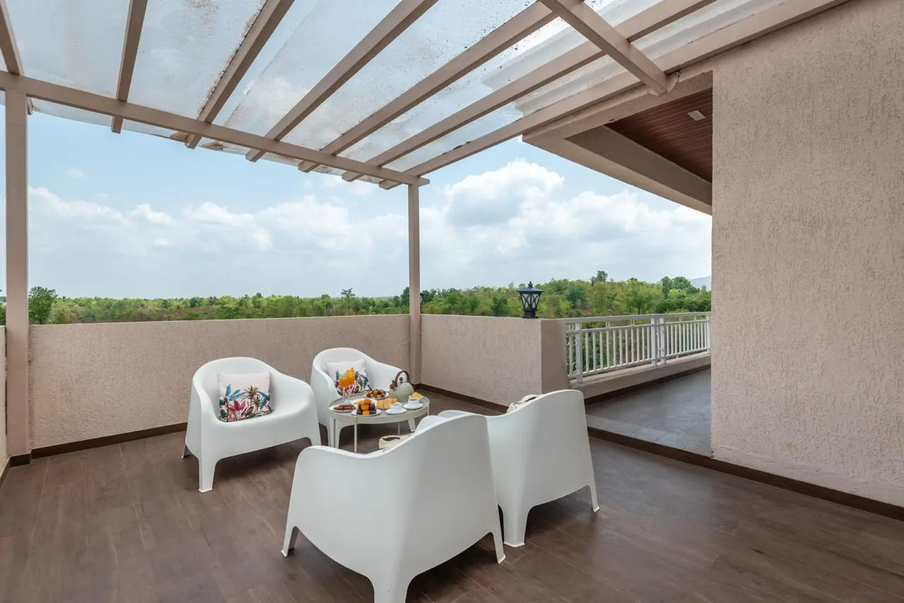 The covered terrace, laid for tea
