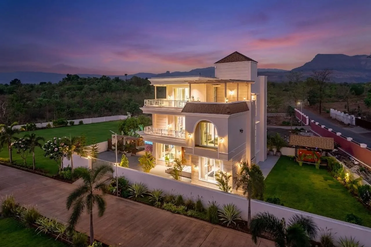The villa from the lawn, three levels and the sky deck